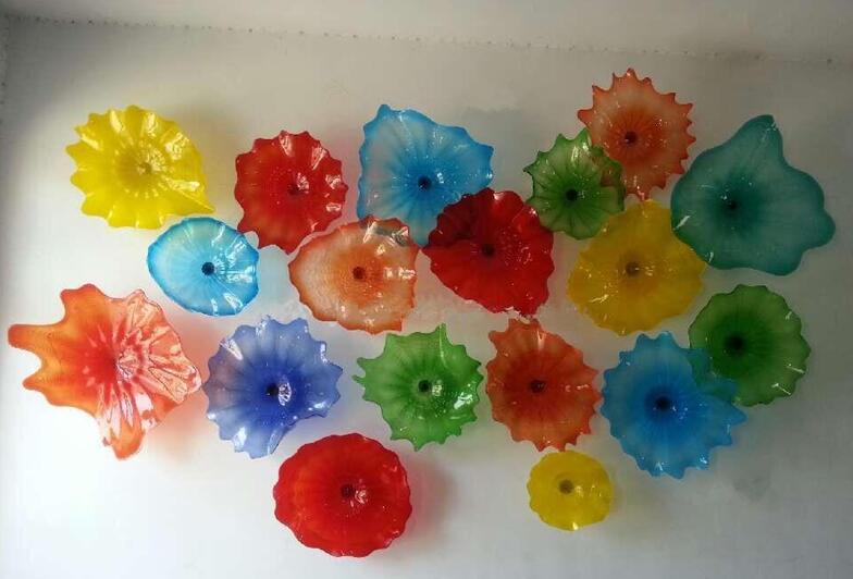Multi-colored Murano glass art lamp with scalloped edges and floral designs, perfect for decorative wall lighting
