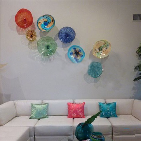 Murano-style handcrafted blown glass wall lamps and decorative Tiffany-colored glass hanging plates