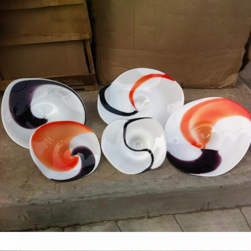 New handcrafted wall-hung glass plates with vibrant colors, perfect for hotel decor and lighting fixtures