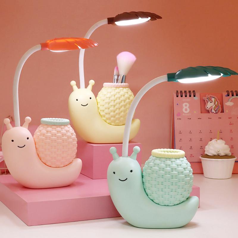 Night USB charging desk lamp with cute pink snail design, featuring LED light and organizer for power bank and PC