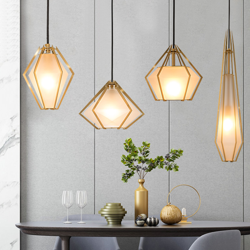 Nordic-inspired geometric pendant lights in rose gold for kitchen islands and dining tables, featuring mid-century modern design