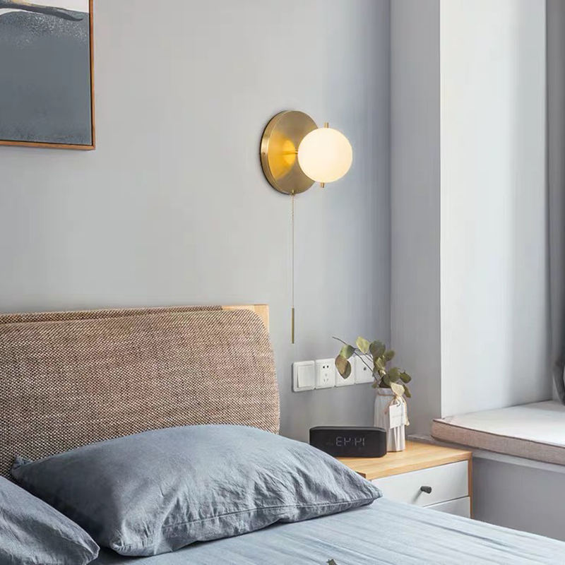 Nordic-inspired glass globe wall light with a postmodern design, perfect for living rooms, staircases, hallways, or golden-toned bedroom bedside spaces