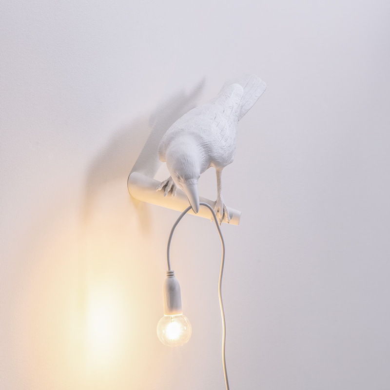 Nordic-inspired resin wall lamp featuring auspicious bird design for bedroom, hallway, or reading nook with decorative LED lighting
