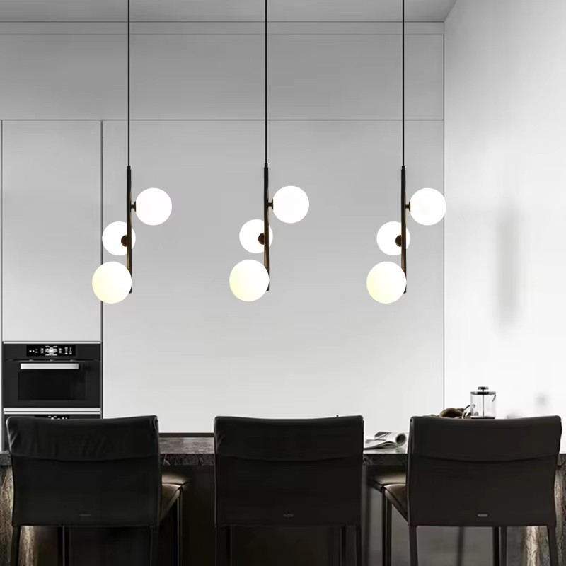 Nordic-style brass and black glass ball LED pendant lights for modern bedroom and living room decor