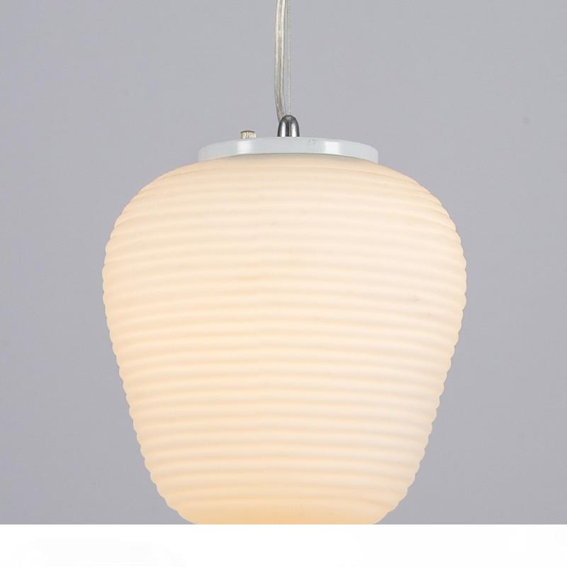 Northern Europe-inspired 3-head pendant light with minimalist white glass globes, perfect for modern kids' rooms