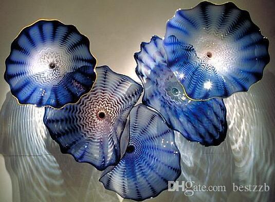 Ocean-inspired handcrafted glass wall art featuring spiral designs in a 16-inch bowl or platter