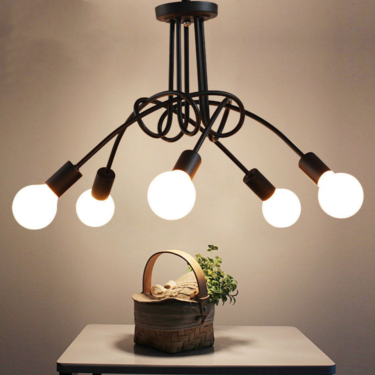 Pendant lamps featuring modern Nordic design with curved gold-plated wrought iron chandeliers for restaurant and lounge lighting
