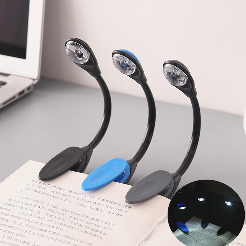 Portable clip-on LED reading light for books, ideal for travel and bedroom use