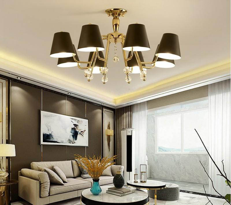 Postmodern pendant lamps by Nordic Wind Lights create an atmospheric black chandelier for living rooms