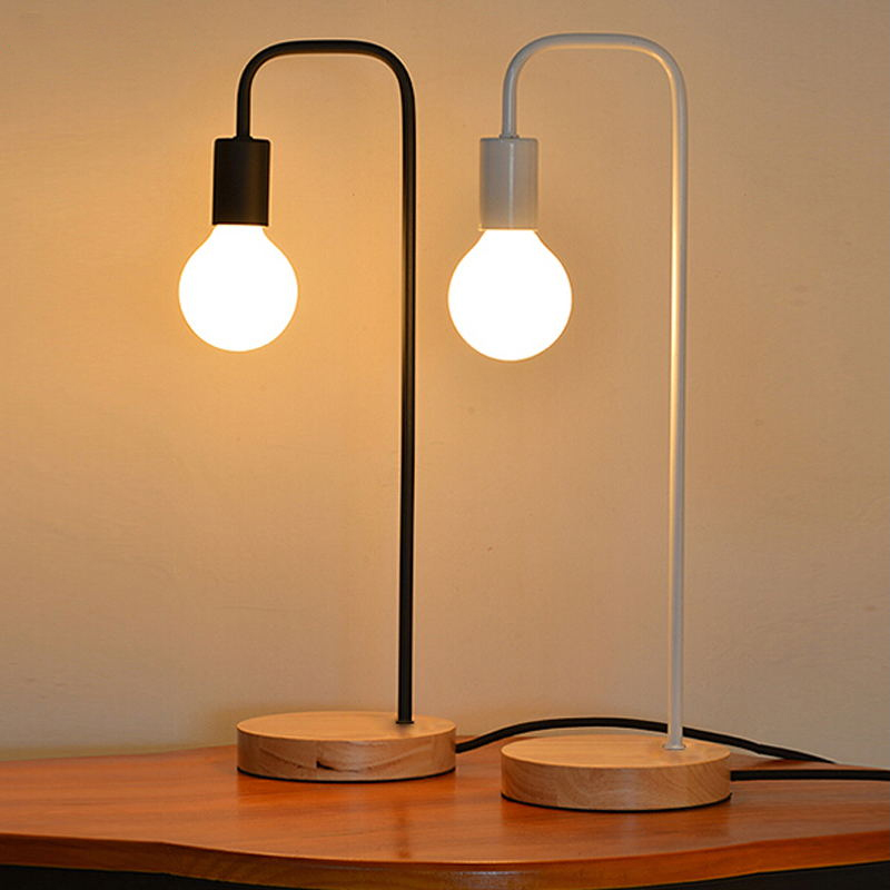 Simple Nordic-style LED desk lamp with a wooden base and iron frame for comfortable reading