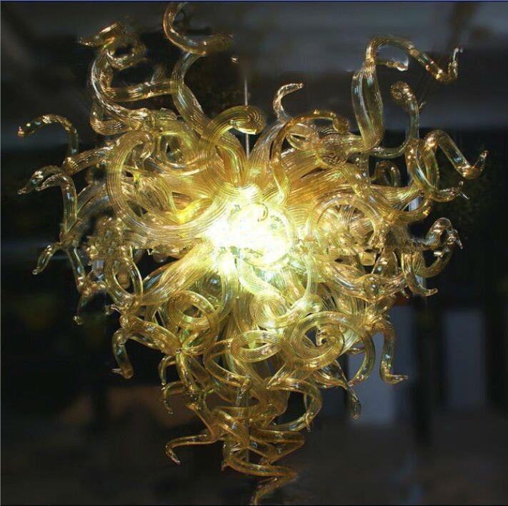 Small handcrafted amber chandeliers with LED lighting and chain suspension