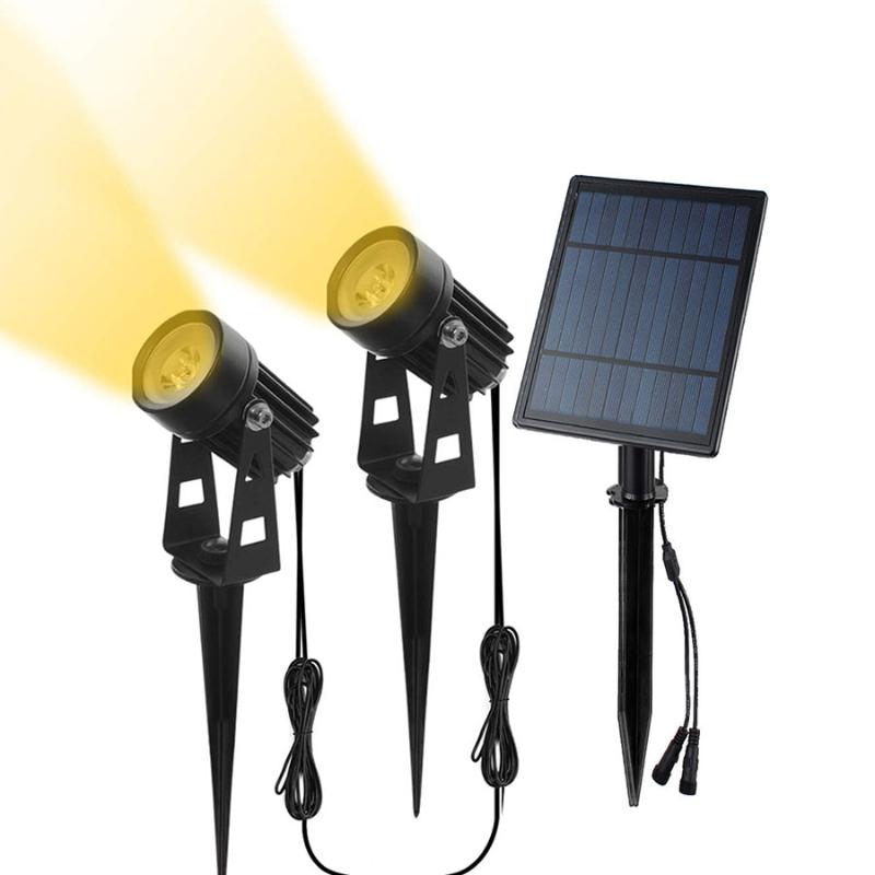 Solar-powered adjustable lawn spotlight with waterproof IP65 rating for garden and tree illumination