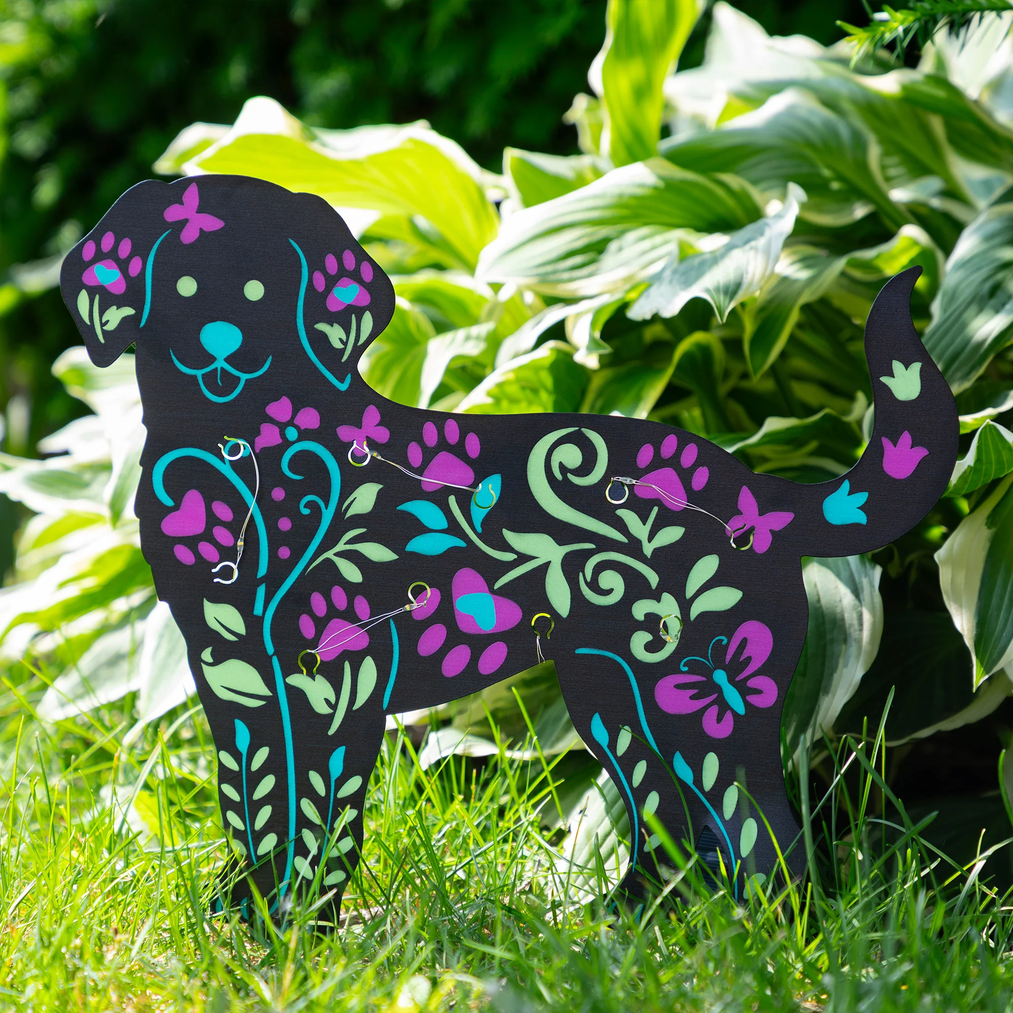 Solar-powered garden stake featuring a playful dog design