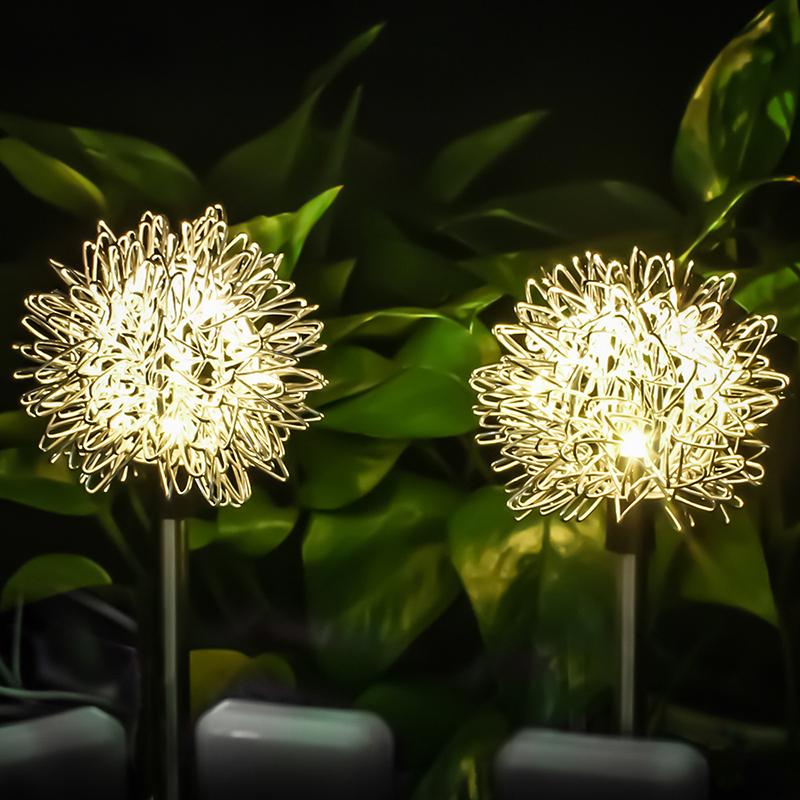 Solar-powered lawn lamps shaped like plants for unique garden and patio decoration