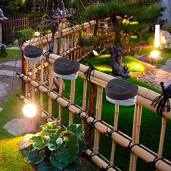 Solar-powered LED fence lights with 2 bright white LEDs for outdoor spaces like porches, yards, and patios