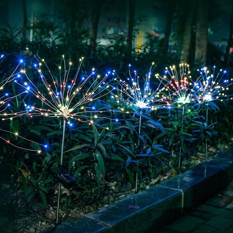 Solar-powered LED lawn lights with colorful flashing fireworks and dandelion designs, waterproof for outdoor garden decor in 2 modes