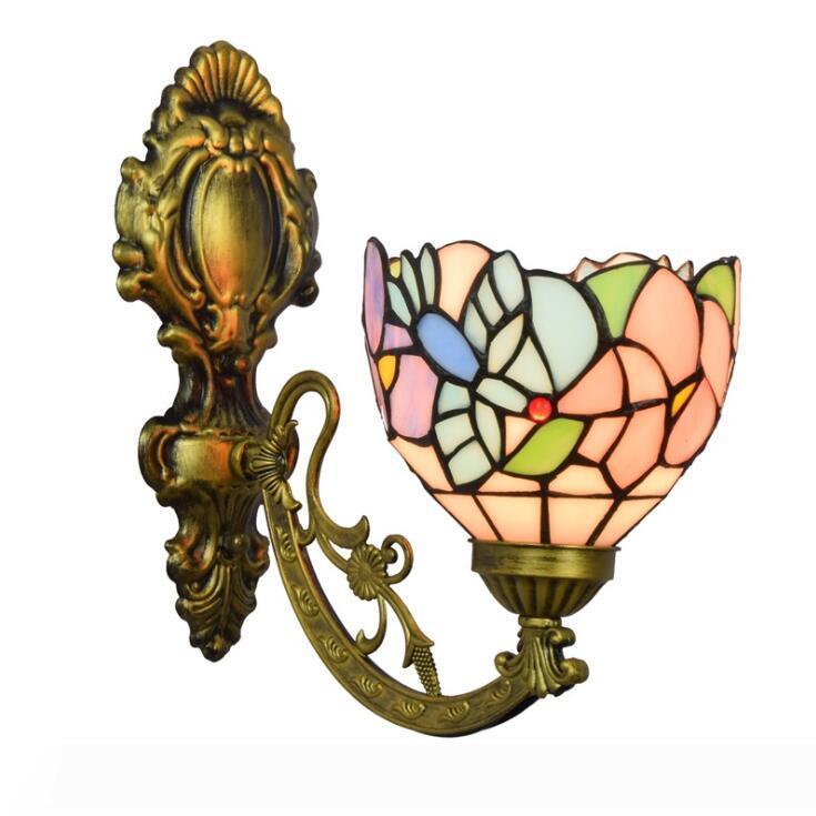 Stained glass floral lampshade wall light with LED for bedside or study, offering versatile up/down lighting in bedrooms