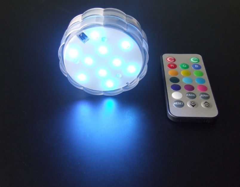 SXI underwater LED lights in flower design for vases, powered by 3 AAA batteries with remote-controlled color changing base
