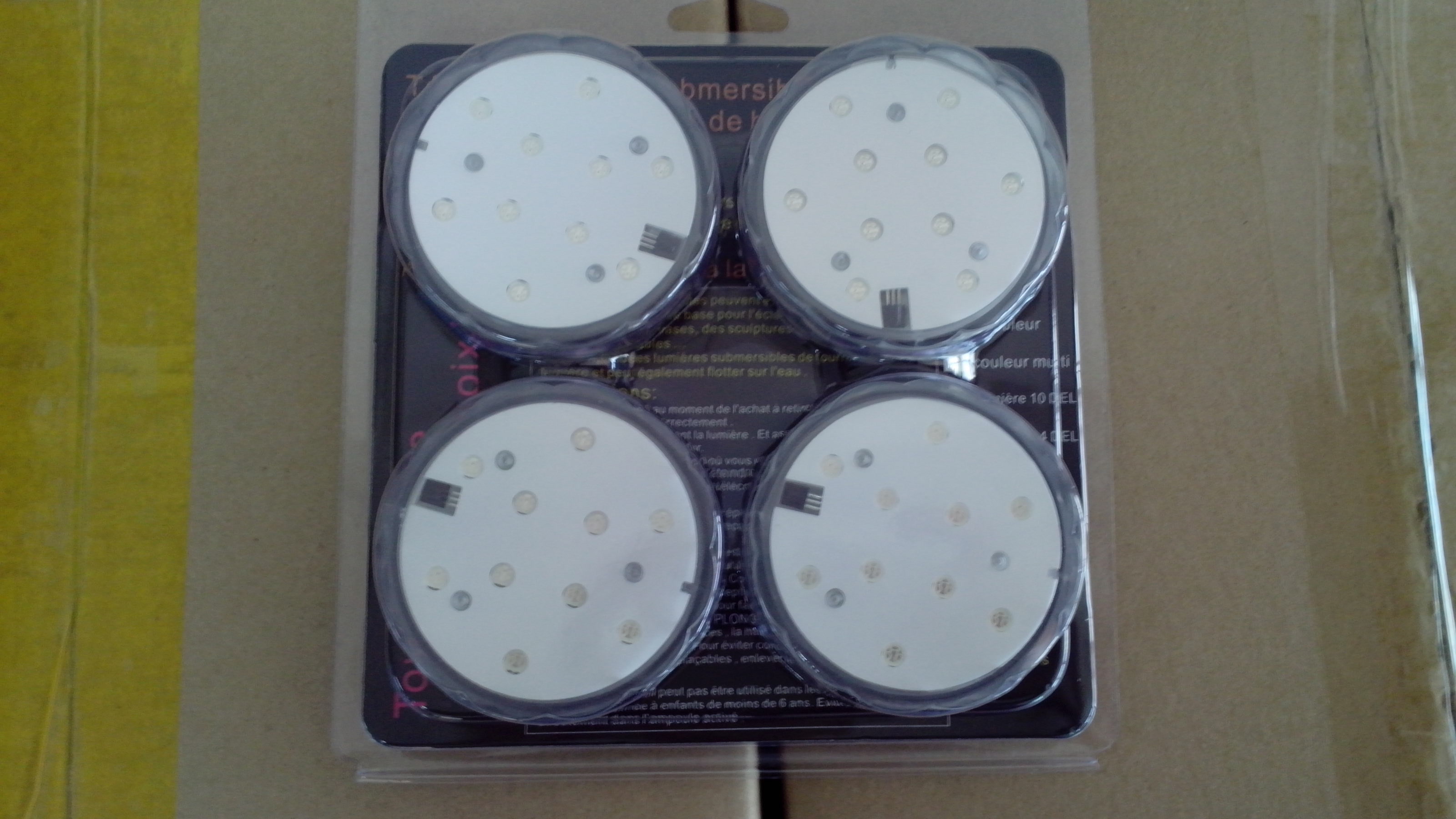 SXI underwater LED lights with remote, powered by 3AAA batteries, featuring white floral bases for vases or crafts