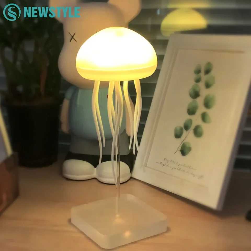 USB-rechargeable jellyfish night light with adjustable RGB colors and polished base for bedside use
