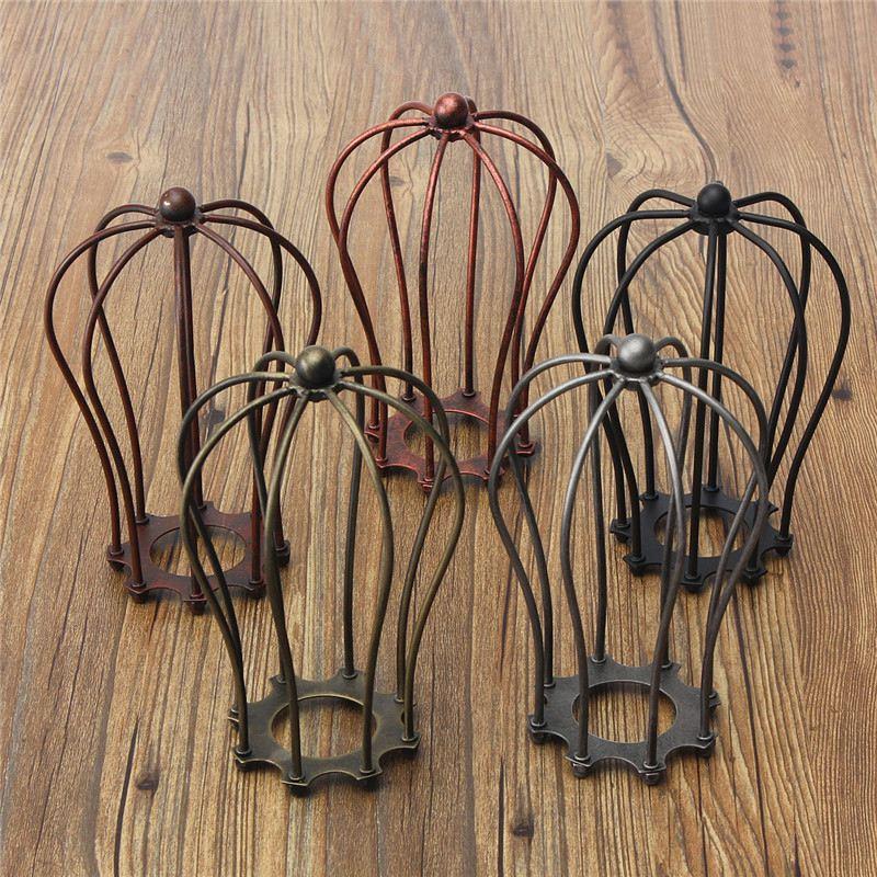 Vintage industrial-style LED wall lights with E27 sockets, featuring retro loft lampshades and iron cage guards for indoor lighting