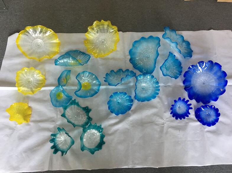Wholesale Murano glass decorative wall plates featuring scalloped edges in blue and yellow shades