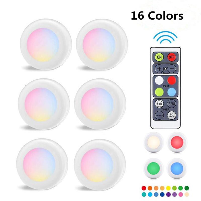 Wireless RGB puck lights with remote, dimmer, and timer for under-cabinet lighting in 16 colors