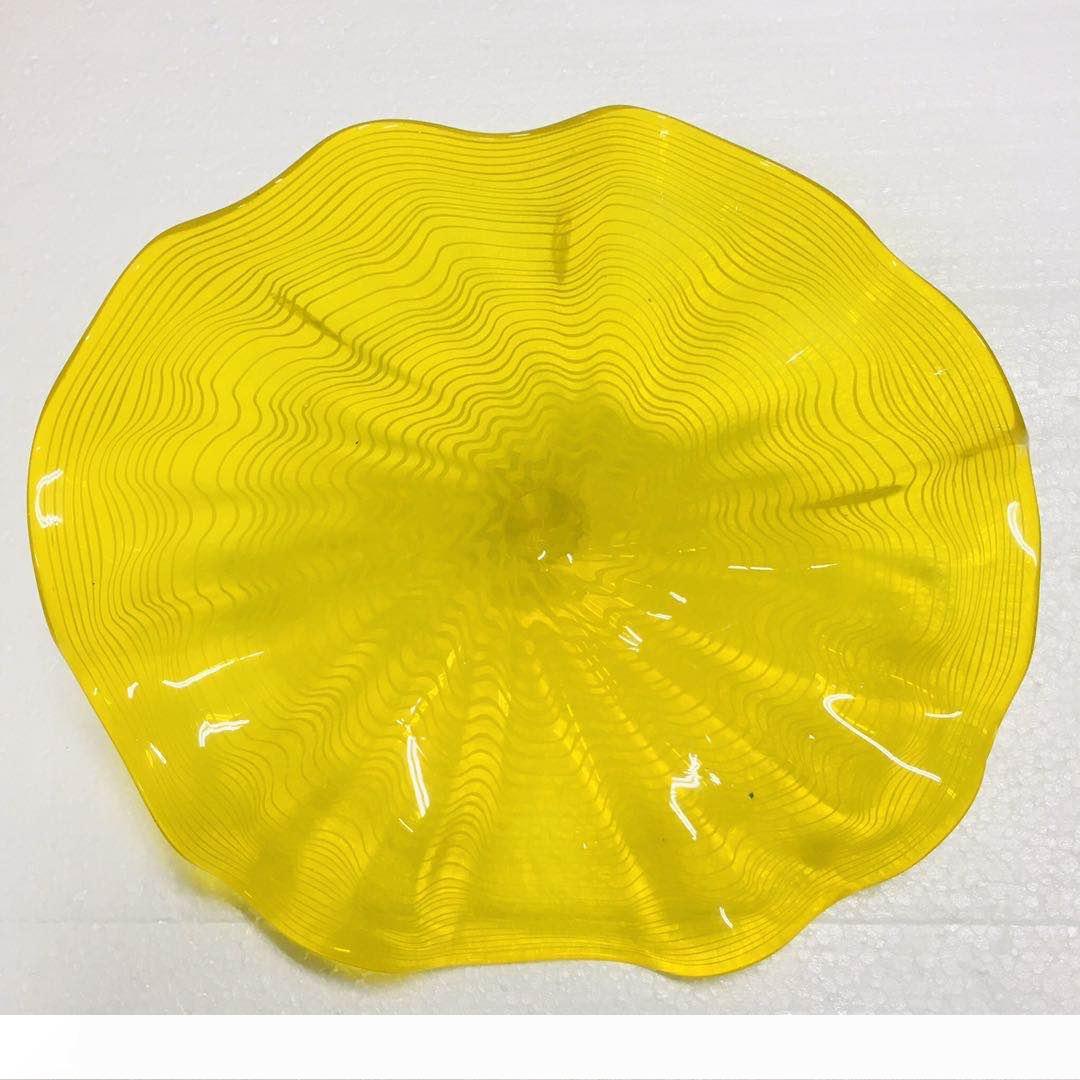 Yellow Murano glass art plates for elegant hotel lobbies, galleries, and museum displays